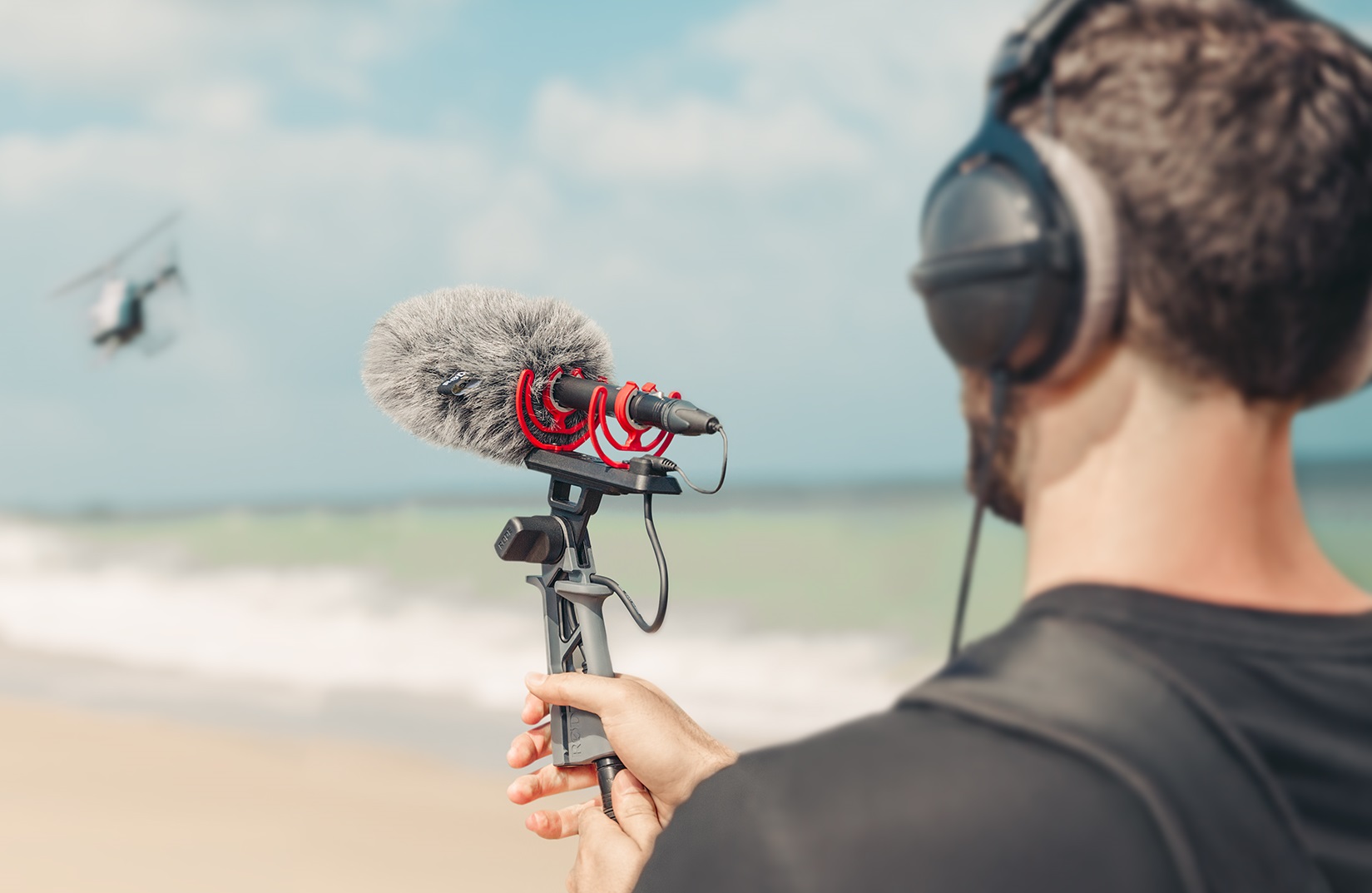 Rode NTG5 microphone being used to record sound on a beach